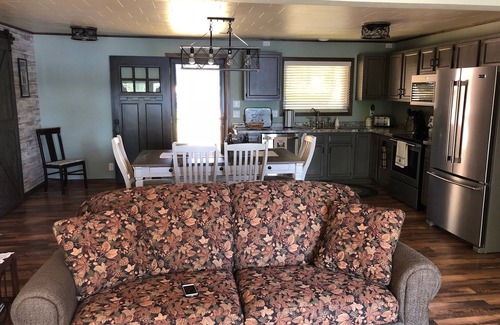 Crivitz Cottage | Lakefront cottage with beautiful sunset view - Private dock and beach area
