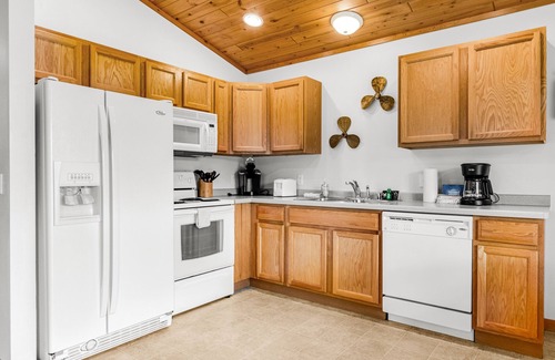 Lake Delton Condo | Lakefront dog-friendly condo near skiing with private beach access, views & dock
