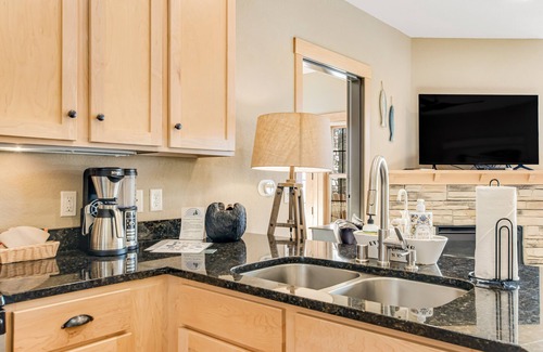 Three Lakes Condo | Lakefront, ground floor condo with indoor pool - fireplace, patio & washer/dryer