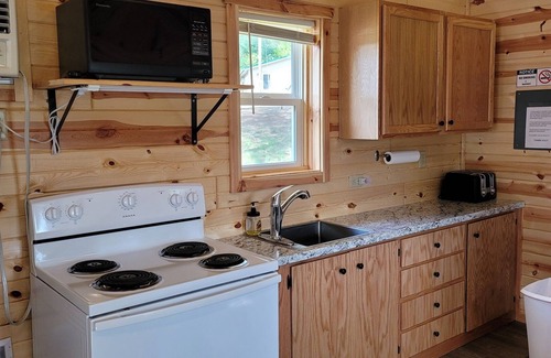 Tomahawk Cabin | Lakefront Lodging, Beach, Fire Pit, Bar & Grill, Rentals, Live Music, Trails