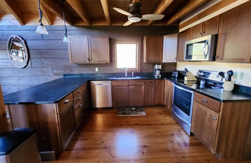 Butler Cabin | Lakefront Lullaby-Rustic cabin w/lake views, boatslip, hot tub & fiber internet