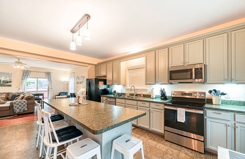 Orange House | Lakeside retreat with a firepit, dock, sprawling deck, pool table - dog friendly