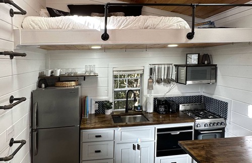 Mills River Cabin | Lakeview tiny home with a loft, full kitchen, furnished deck, & firepit