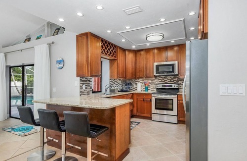 East Naples House | Larg heated pool, 3 bdrm, 2 bath, fast wi-fi, ps3, 4 smart TVs, large lanai with 2 covered areas.