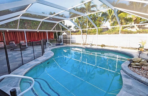 East Naples House | Larg heated pool, 3 bdrm, 2 bath, fast wi-fi, ps3, 4 smart TVs, large lanai with 2 covered areas.