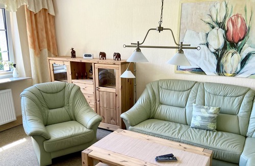 Woltersdorf Apartment | Large apartment with garden, barbecue area, rowing boat, jetty, SUP boards