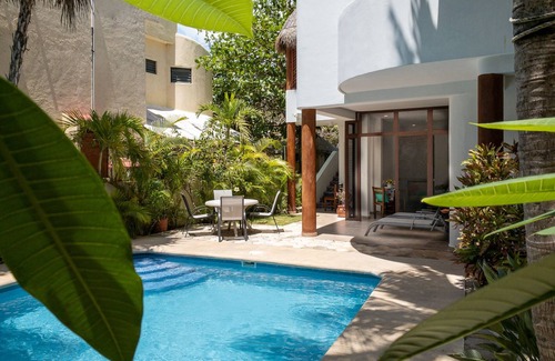 Puerto Morelos Apartment | Large studio with king bed, full kitchen, sofa bed. Half wall separating.