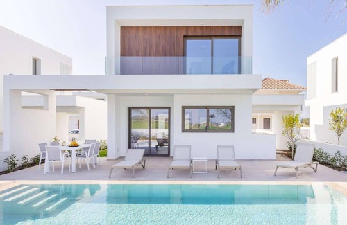 Softades House | Larnaca Blue 16 is a contemporary villa on a gated complex.
