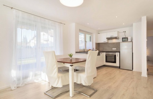 Enzisweiler Apartment | Light-flooded and Modern Apartment “Gartenstraße” with Terraces and Garden