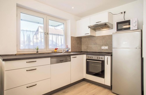Enzisweiler Apartment | Light-flooded and Modern Apartment “Gartenstraße” with Terraces and Garden