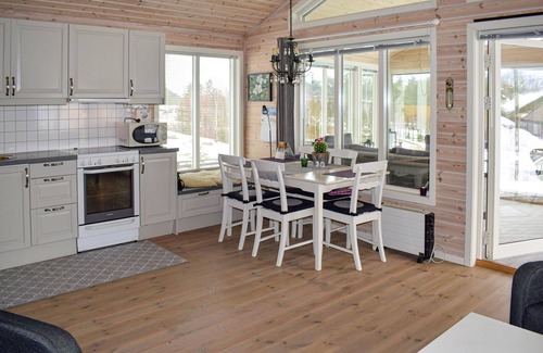 Nissedal House | Light-flooded vacation home with spacious conservatory and great views of Lake Niss.