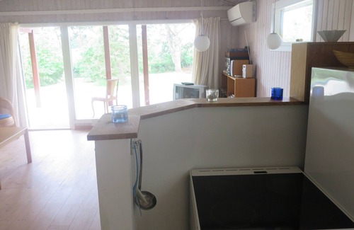 Follenslev Cottage | Light wooden cabin at Zealand's best beach.