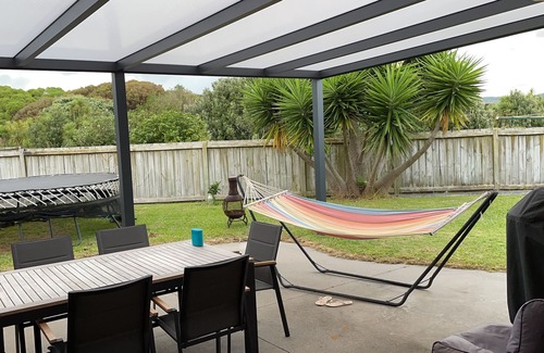 Papamoa Beach House | LOCATION. Close to the beach, reserve and shops. Fenced yard with a Spa.
