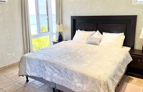 West Bay Condo | Location! Location! Location! 3 Bedroom Condo Located Right on West Bay Beach