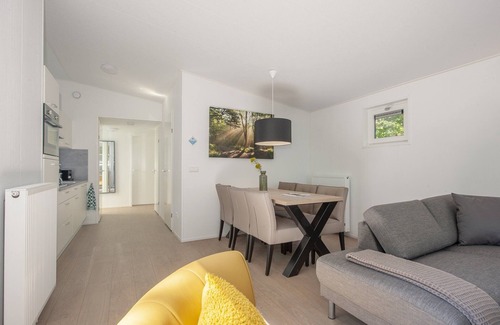Municipality of Geldrop-Mierlo Ski Chalet | Lodge in Bospark 't Wolfsven with Garden