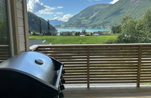 Loen Apartment | Loen Panorama in Stryn, outdoor hot tub with fjord and mountain views