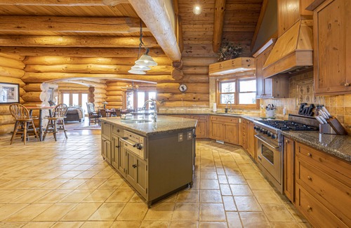 Lakeland Cabin | Log Cabin Mansion fronting Strawberry and Bass Lake with large oversized suites.