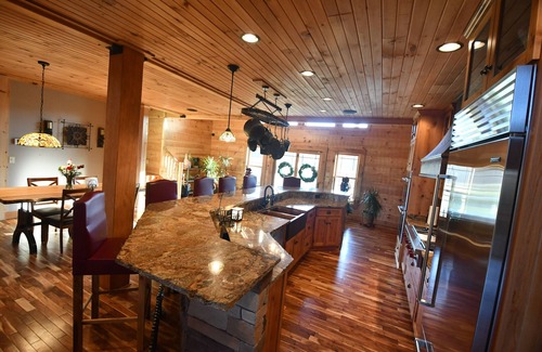 Commiskey House | Log cabin on 108 private acres - cozy inside, adventure outside!