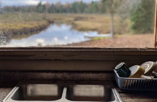 Gerrish Township Cabin | LOG CABIN W/SAUNA ON THE CUT RIVER AT HIGGINS LAKE