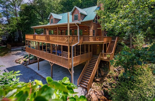 Sylva Cabin | Log cabin with large decks on the Bank of the Tuckasegee River.