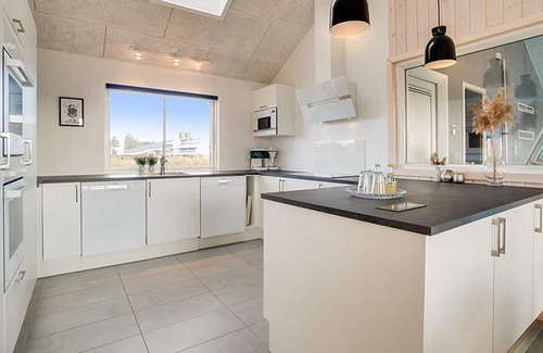 Klegod Strand House | Long drawn activity house with 18 m² swimming pool with slide, wifi and oven