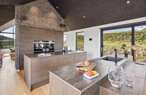 Hejlsminde Strand House | Look forward to a beautiful sea view in this attractive vacation home with outdoor wellness.