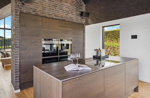 Hejlsminde Strand House | Look forward to a beautiful sea view in this attractive vacation home with outdoor wellness.