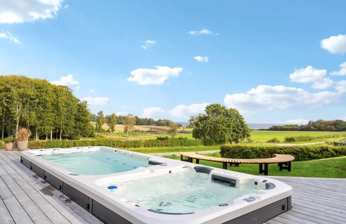 Hejlsminde Strand House | Look forward to a beautiful sea view in this attractive vacation home with outdoor wellness.