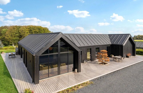 Hejlsminde Strand House | Look forward to a beautiful sea view in this attractive vacation home with outdoor wellness.
