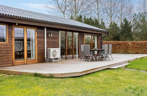 Skibby House | Look forward to this light-flooded and beautiful vacation home with a spacious wooden terrace.