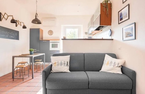 Ancona Condo | Lovely apartment with fireplace station area