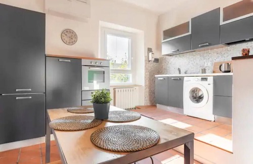 Ancona Condo | Lovely apartment with fireplace station area