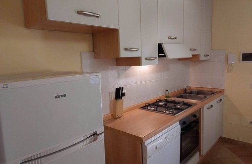 Rosignano Marittimo Apartment | Lovely flat with private covered terrace, pool, large shared garden.