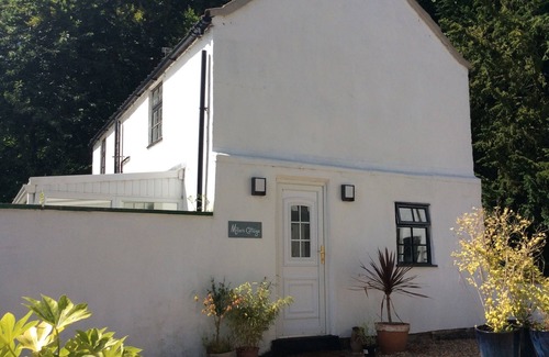 Alford Cottage | Lovely riverside cottage in the grounds of a landmark watermill