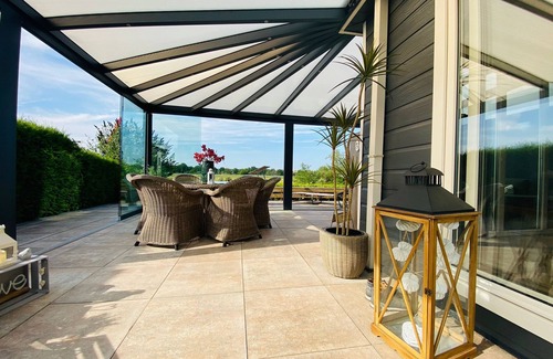 Lathum Ski Chalet | LuxChalet vacation home ELLA view on Ijssel in vacation park Pool Strand Holland