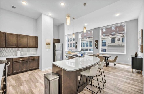Gateway District Apartment | Luxe Flat with Heated Pool, Sauna, Rooftop Deck, Gym