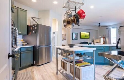 Wetmore House | Luxe Home-Designer BTHRM-Covered Deck-Weber Grill