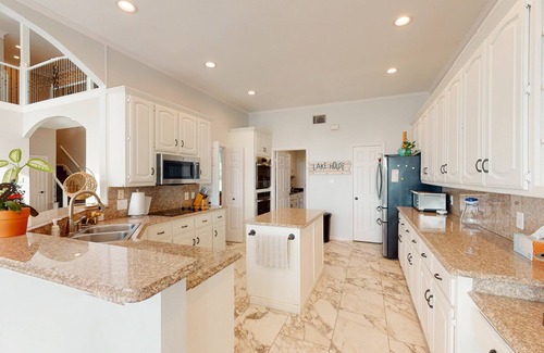 Rowlett House | Luxe, lakefront home with amazing private pool with fountain & home office