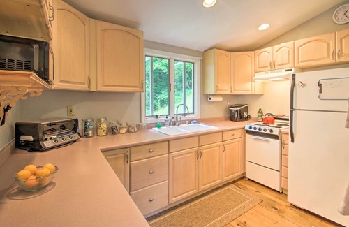 Weare Cottage | Luxe Riverfront Cottage w/Dock by Lake Horace!