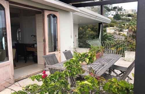 Bantry Bay Villa | Luxurious en-suite bedroom with lounge stunning sea view & balcony in Bantry Bay