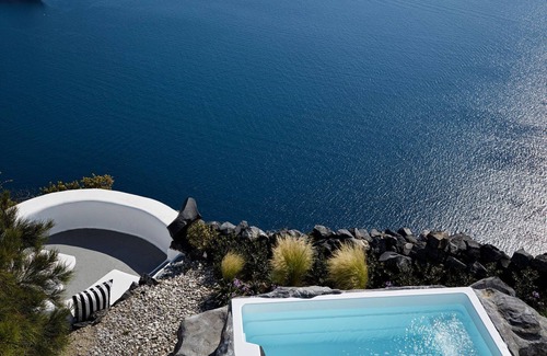 Firostefani Villa | Luxurious Imerovigli Villa | 7 Bedrooms | Caldera View | Private Pools |.