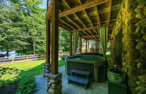 Bumpass Cabin | Luxurious lakefront cabin with hot tub, game room, & washer/dryer- dog friendly