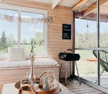 Nye House | Luxurious red cottage with wood stove near lake