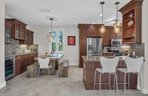 Stillwright Point House | Luxurious tropical water-front Heated pool home with Boat Dock and two master .