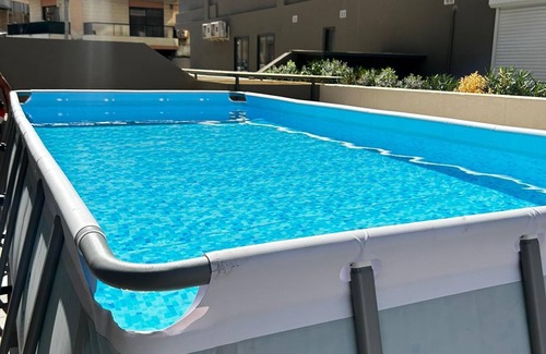 Qawra Apartment | Luxury 3-Bed Apt in Qawra–AC, WiFi & Private Pool! Your perfect getaway awaits!