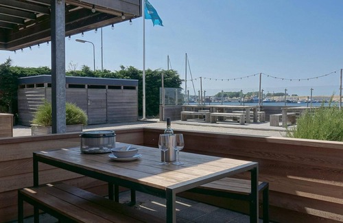 Stellendam House | Luxury apartment with private terrace, spacious living room, and stunning view of the Inner Harbor.