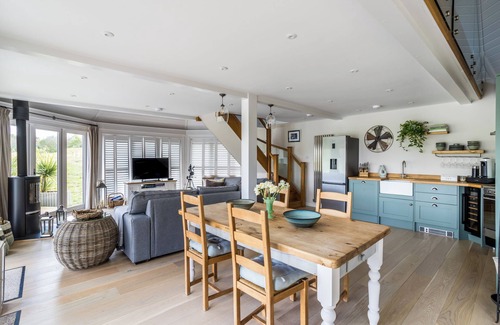 Barns Green House | Luxury Boathouse situated on a private lake, with panoramic views and a hot tub.