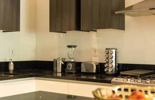 Colonia El Progreso Condo | Luxury Condo in Gated Community with Resort Amenities minutes from the Marina