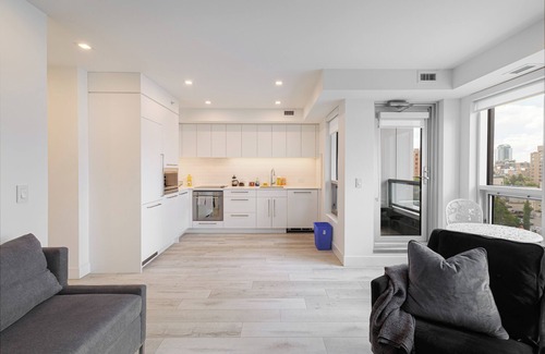 Lower Mount Royal Apartment | Luxury Downtown Suite w/Balcony Views, Air Conditioning + Free Parking