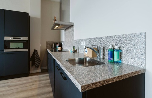 Ouddorp House | Luxury flat overlooking the marina for 10 people.